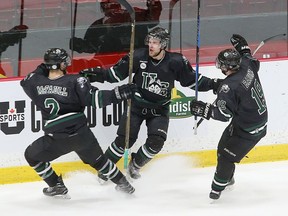 Kendall McFaull (left), Levi Cable and Kohl Bauml celebrate Cable's Thursday-afternoon game-winning overtime goal. The University of Saskatchewan Huskies beat the York Lions 1-0 in overtime Thursday at the University Cup quarter-finals in Fredericton. Photo by U Sports/James West.
