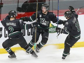 Levi Cable (10) and the University of Saskatchewan Huskies celebrate a 1-0 overtime victory Friday over the York University Lions in 2017 Cavendish Farms University Cup quarter-final action at Fredericton, New Brunswick.