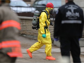 The hazardous materials unit recovers a suspicious package that was declared non-hazardous from an office building at 211 Fourth Avenue South in Saskatoon on March 27, 2017. (Michelle Berg / Saskatoon StarPhoenix)