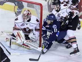 Saskatoon's Arjun Atwal is stopped by Calgary goalie Cody Porter during WHL action Wednesday.