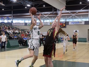 REGINA, SASK : March 25, 2017 - Saskatoon Holy Cross's Katriana Philipenko, #6, shoots for two points against Saskatoon Centennial Collegiate's Micah Bartel, #6, during the Hoopla 5A girls final. MICHAEL BELL / Regina Leader-Post.