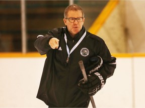 University of Saskatchewan Huskies coach Dave Adolph, seen here at practice at Rutherford Rink, has been named Canada West men's hockey coach of the year for the third time since 1998.