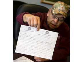 Phillip Ledoux holds one of the letters his uncle Charles Mususkapew wrote while stationed in England during the First World War. He took part in the Battle of Vimy Ridge, but died later at the Battle of Amiens.