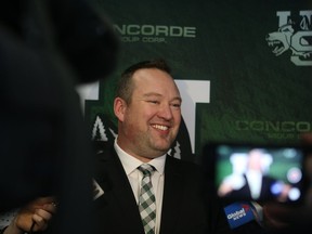 Scott Flory speaks to the press after the Huskies announced his hiring Monday.