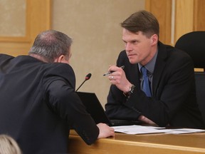 Mayor Charlie Clark speaks to Randy Donauer during a special city council meeting at noon in Saskatoon on March 26, 2017.