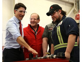 Prime Minister Justin Trudeau talks with Dillon Frater, an All Agriculture Equipment Technician program student, during his visit to Saskatchewan Polytechnic in Saskatoon on March 29, 2017.