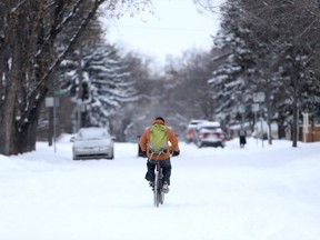 A morning commuter biked to school after a heavy snowfall over the weekend in Saskatoon on March 6, 2017.