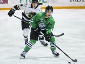 Huskies defender Jesse Forsberg moves the puck with Manitoba Bisons' Rene Hunter chasing him at Rutherford Rink in Saskatoon on February 4, 2017.