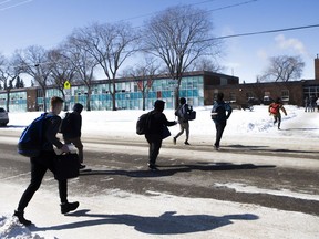 Students can be seen jaywalking across Clarence Avenue to Aden Bowman Collegiate from the parking lot of the Churchill Shopping Centre in Saskatoon, Sask. on Thursday, March 9, 2017. A report headed to the city's transportation committee on Monday may result in jaywalkers at the school looking for an alternative--and legal--route.