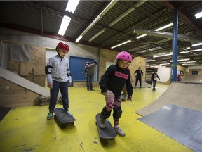 Roman Biro and Ashlee Biro learn to skateboard during a lesson at the Saskatoon Indoor Skatepark in Saskatoon, March 11, 2017.