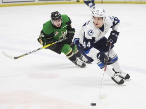 Prince Albert Raiders forward Sean Montgomery skates behind Saskatoon Blades forward Chase Wouters during WHL action Friday at SaskTel Centre.