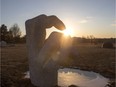 SASKATOON,SK--MARCH 20/2017-0321 SPEC- The sunset behind a a sculpture at the University of Saskatchewan sculpture garden along the banks of the South Saskatchewan River in Saskatoon, SK on Monday, March 20, 2017. (Saskatoon StarPhoenix/Liam Richards)