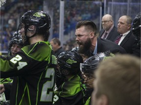 With Rush head coach Derek Keenan in the background, Saskatchewan assistant coach Jimmy Quinlan yells out encouragement to his players during a timeout in a NLL game Friday against the Calgary Roughnecks at the SaskTel Centre in Saskatoon.