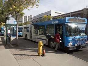 Riders in downtown bus mall, Thursday, September 18, 2014.