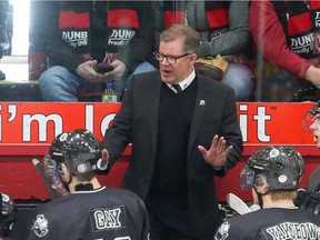 University of Saskatchewan Huskies head coach Dave Adolph addresses his team during their University Cup loss to New Brunswick.