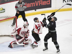 University of Saskatchewan Huskies Levi Cable, 10, right, and University of New Brunswick Varsity Reds Philippe Maillet, 16, wait for the puck to drop in front of the UNB goal during the first period at the Canadian University Men's hockey championship gold medal game in Fredericton, N.B., on Sunday, March 19, 2017.