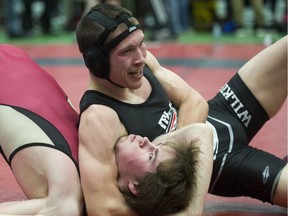 High school wrestlers are in action on the mats in Saskatoon gearing up for the league dual quad summit championships on Wednesday and junior cities on Thursday. In the photo: Reid Smith from Centennial Collegiate and August Bayliss from Wilkie on March 18, 2017 in Warman. (Saskatoon StarPhoenix/Kayle Neis)