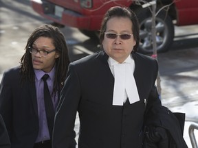 Lawyer Donald Worme (right), counsel for Blaine Taypotat, who pleaded guilty to manslaughter and impaired driving causing the death of conservation officer Justin Knackstedt, arrives along with Mi’kmaw lawyer Victor Carter (left) at Queen's Bench Court on April 8, 2015 (GREG PENDER/STAR PHOENIX)