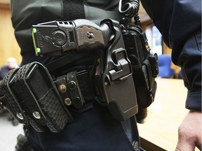 A Taser-brand conducted energy weapon seen on the belt of a Saskatoon police officer.