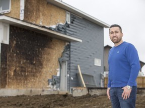 Sam Hermez alerted a local family to the fact their house was being damaged by fire last week and is now being praised as a hero for his bravery by the homeowners. In the above shot, he poses for a photograph in front of the remains of a house that was on fire in Saskatoon, SK on Thursday, April 13, 2017.