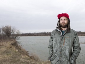 BESTPHOTO  SASKATOON,SK--APRIL 13/2017-0415 News Meewasin reaction- Marcus Storey, owner of Escape Sports, who offers paddle board tours that launch from Poplar Bluffs stands for a photograph along the South Saskatchewan river on his launch site that Meewasin will be closing down due to budget cuts in Saskatoon, SK on Thursday, April 13, 2017. (Saskatoon StarPhoenix/Liam Richards)