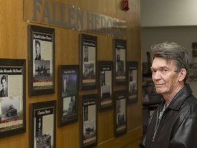 George Seitz, with the Canadian Fallen Heroes Foundation, stands by a wall commemorating Saskatchewan war dead at the Nutana Legion in Saskatoon, SK on Tuesday, April 18, 2017. The foundation hopes to create individual memorials for every Saskatchewan residents who has died in the line of duty. (Saskatoon StarPhoenix/Liam Richards)