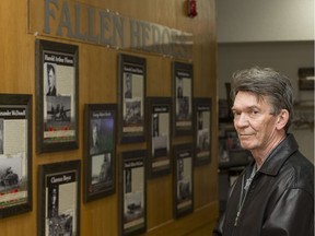 George Seitz, of the Canadian Fallen Heroes Foundation, stands at a memorial wall in Royal Canadian Legion Branch 362 in Saskatoon.
