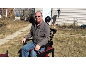 Dave Cummine, a Saskatoon upcycler, shows off his one of a kind skeleton chair.