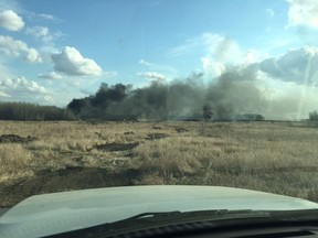 Firefighters responded to a grass fire west of Saskatoon on Tuesday (Saskatoon Fire Department).