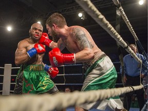 Saskatoon's Paul Bzdel (right) fights Shaklee Phinn during Saskatoon's first pro boxing card in many years last February.