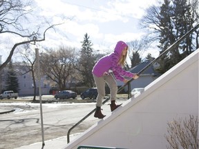 SASKATOON, SASK--MARCH 13 2016 9999 News WEATHER- Amalia Janzen climbs a railing on Grace-Westminister United Church during a sunny afternoon in Saskatoon, Saskatchewan on Sunday, March 13th, 2016. (Kayle Neis/Saskatoon StarPhoenix)