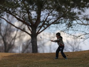 Elijah Caplette, 6, plays his first round of golf of the season at Wildwood golf course in Saskatoon.