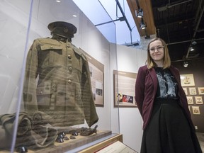Erin Isaac stands for photography with a uniform that is part of two new exhibits commemorating the Great War on Vimy Ridge Day at the Diefenbaker Canada Centre (DCC) at the University of Saskatchewan in Saskatoon, SK on Friday, April 7, 2017.