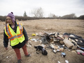 SASKATOON,SK--APRIL 18/2017-0418-NEWS-JULIA ADAMSON- Julia Adamson walks around the Richard St. Barbe Baker Afforestation Area to show examples of illegal dumping in which she is lobbying for more effective policing for the park in Saskatoon, SK on Tuesday, April 18, 2017. (Saskatoon StarPhoenix/Kayle Neis)
