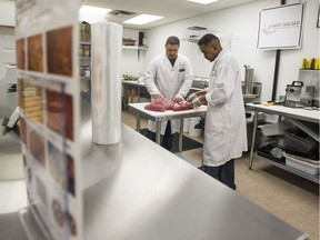 Ayman El Chayeb, left, and Esam Mohammad work at Petra Market and Jerusalem Butcher Shop in Saskatoon, SK on Wednesday, April 19, 2017. (Saskatoon StarPhoenix/Liam Richards)