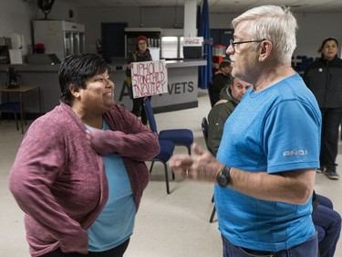 Lane Cooper, right, asks Songgirl Reyes-Starr, a relative of Neil Stonechild, to leave the Army, Navy & Airforce Veterans building during a book signing by Candis Mclean.