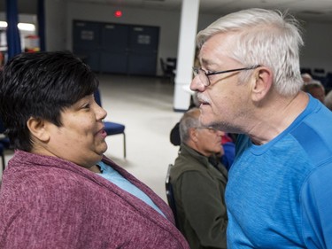 Lane Cooper, right, asks Songgirl Reyes-Starr, a relative of Neil Stonechild, to leave the Army, Navy & Airforce Veterans building.