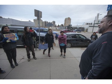 Stan Goertzen, former president of the Saskatoon City Police union, right, speaks with Songgirl Reyes-Starr, a relative of Neil Stonechild, outside of the Army, Navy & Airforce Veterans building during a book signing by Candis Mclean who wrote "When Police Become Prey" in Saskatoon, SK on Monday, April 24, 2017. (Saskatoon StarPhoenix/Liam Richards)