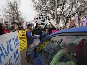 Protesters block vehicles trying to enter Prairieland Park for a Premier's Dinner fundraiser for the Saskatchewan Party in Saskatoon, April 27, 2017.
