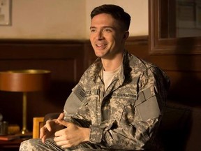 This image released by Netflix shows Topher Grace in a scene from &ampquot;War Machine.&ampquot; Grace stars opposite Brad Pitt in the streaming service&#039;s original new military satire &ampquot;War Machine,&ampquot; which hits Netflix in Canada on Friday. THE CANADIAN PRESS/AP-Francois Duhamel/Netflix via AP