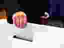 Close-up of a man's hand putting his vote in the ballot box.