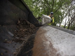 City of Saskatoon employee Wes Gamble cleans the parking lot at Victoria Park on May 25, 2017.