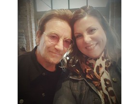 Bono from the band U2 poses with Saskatoon fan Tanis Robertson.