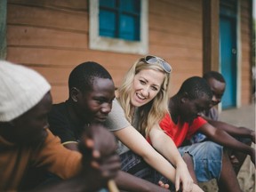 Cassandra Basnett Lee, centre, with students from Congo where her organization, Justice Rising, has helped build schools in areas of need. Submitted Photo