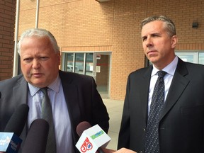 Dave Deplaedt, right, the owner of Playful Paws kennel in Saskatoon, and his lawyer, Scott Spencer, speak to the media after Deplaedt pleaded guilty Tuesday in the deaths of 14 dogs in an overheated room in September. Deplaedt apologized and agreed to pay a fine of $19,600 in the case. (PHIL TANK/The StarPhoenix)