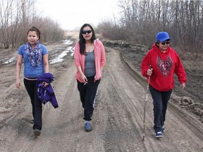 (From left) Ariel Charles and Marcia Bird, two daughters of Happy Mary Charles, join her mother, Regina Poitras, in the search for the missing woman. (Photo by Arthur White-Crummey, Prince Albert Daily Herald)