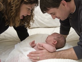 Mother and Father admiring their baby