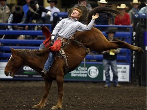 Danny Vandenameele from Langenburg, Saskatchewan competes in Bareback during the Saskatoon Spring Rodeo at SaskTel Centre on May 14, 2017.