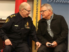 Chief Clive Weighill and Federal Public Safety Minister Ralph Goodale speak to each other before announcing a boost to crime prevention funding that will support Saskatoon's youth and their families at Saskatoon Police Headquarters in Saskatoon on May 24, 2017.