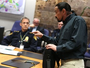 SASKATOON, SK - May 24, 2017 - Dion Waniandy, who was Tasered by police in his apartment in June of 2016 by police at the wrong address, speaks to Police Chief Clive Weighill and Mayor Charlie Clark during the Board of police commissioners meeting at City Hall in Saskatoon on May 24, 2017. (Michelle Berg / Saskatoon StarPhoenix)